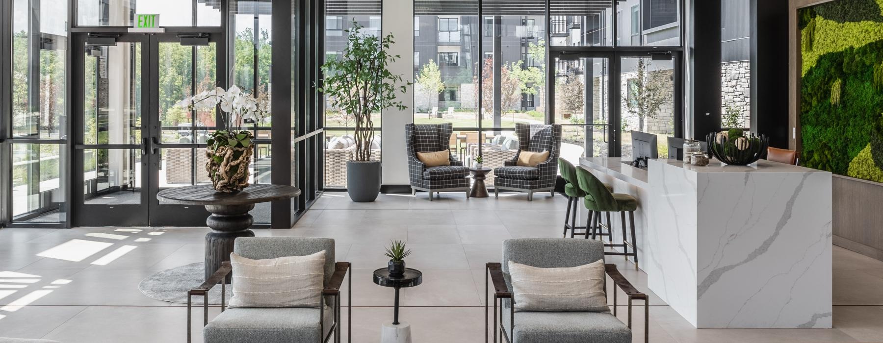 a room with a table chairs and a large window